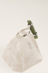 Australian Jade ring displayed on clear quartz, with oxidized sterling silver setting and lush green gemstone.