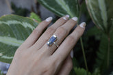 Australian Ocean Kyanite ring shown worn on a hand, with oxidized sterling silver and deep blue crystal setting.