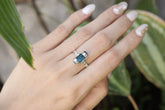 Azure Blue Apatite ring shown worn on a hand, with oxidized sterling silver and vivid terminated crystal setting.