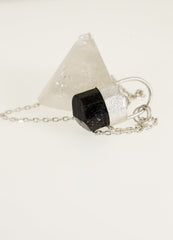 Brown Dravite Tourmaline Diamond pendant shown with clear quartz display crystal, sterling silver chain, and textured silver setting.