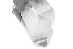Close-up of Clear Quartz crystal point showing natural facets, internal clarity, and polished sterling silver cap.