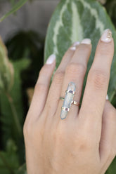 Double Terminated Aqua Aura Lemurian Quartz Ring shown worn on hand with oxidized sterling silver and electric blue crystal point.