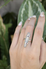 Double Terminated Aqua Aura Lemurian Quartz Ring shown worn on hand with oxidized sterling silver and electric blue crystal point.
