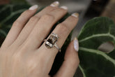 Handmade oxidized 925 sterling silver Dravite Tourmaline ring shown worn on the hand, with warm brown gemstone and hammered band.