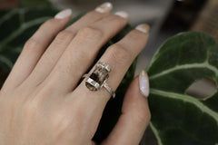 Handmade oxidized 925 sterling silver Dravite Tourmaline ring shown worn on the hand, with warm brown gemstone and hammered band.