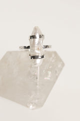 Mother of Pearl ring displayed on clear quartz, with oxidized 925 sterling silver setting and soft iridescent nacre glow.