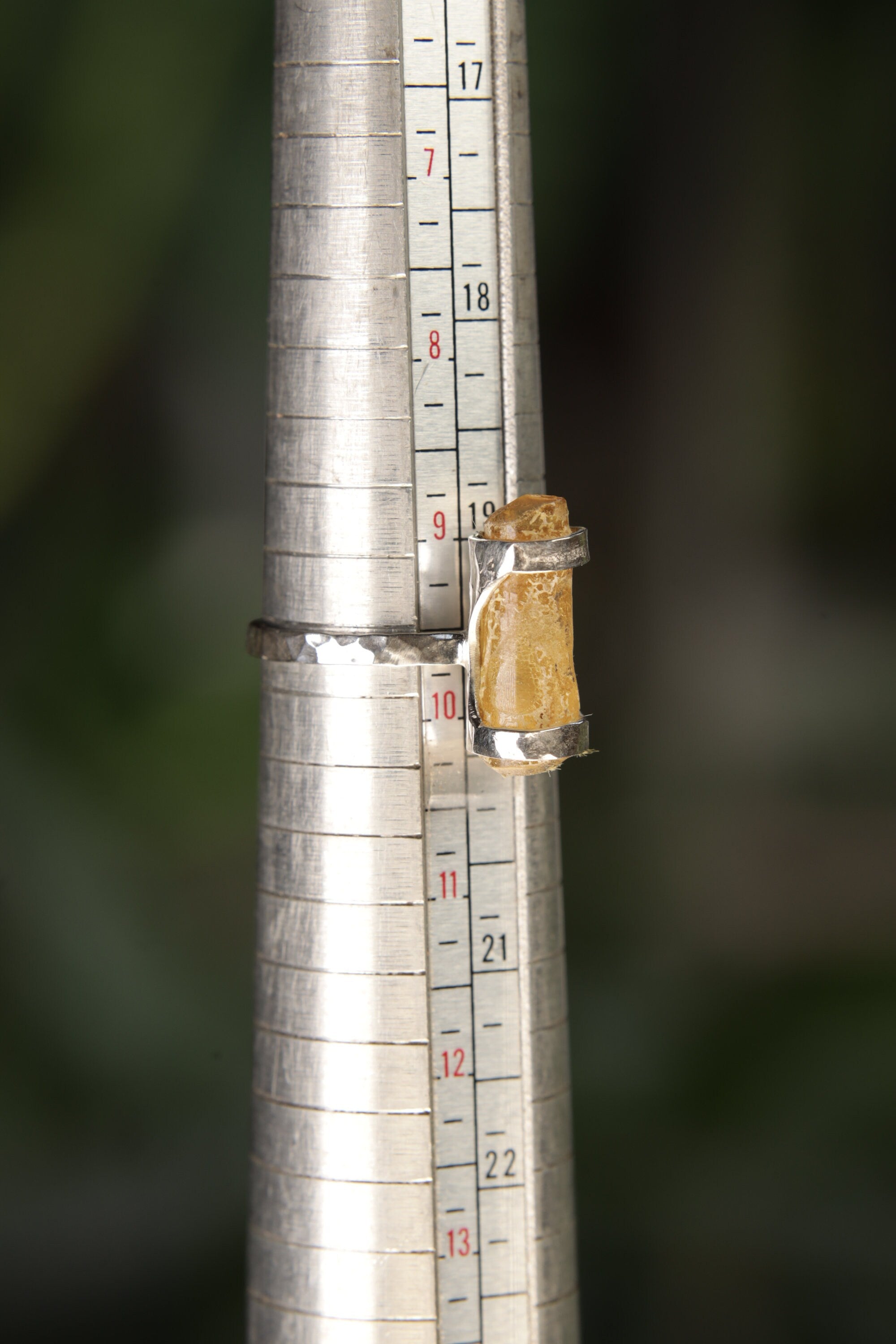 Natural Amber sterling silver ring shown on a mandrel for size reference, appearing around US size 9.5 to 10.