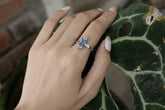 Handmade oxidized 925 sterling silver Australian Ocean Kyanite ring shown worn on the hand, with deep blue crystal and hammered band.