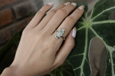 Raw Australian Aquamarine Oxidized Silver Ring shown worn on hand with blue-green crystal and hammered sterling silver band.