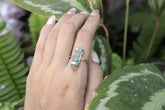 Handmade oxidized 925 sterling silver Himalayan Aquamarine ring shown worn on the hand, with clear blue beryl gemstone.