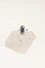 Raw Australian Ocean Kyanite ring shown worn on the hand as a deep blue Throat Chakra gemstone ring in oxidized silver.