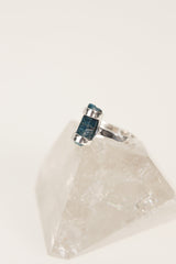 Blue Apatite silver ring shown worn on a hand, with vivid blue crystal and rugged oxidized handmade band.