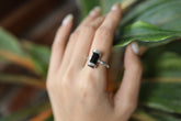 Terminated Black Tourmaline Ring shown worn on hand with oxidized sterling silver and raw black crystal point.