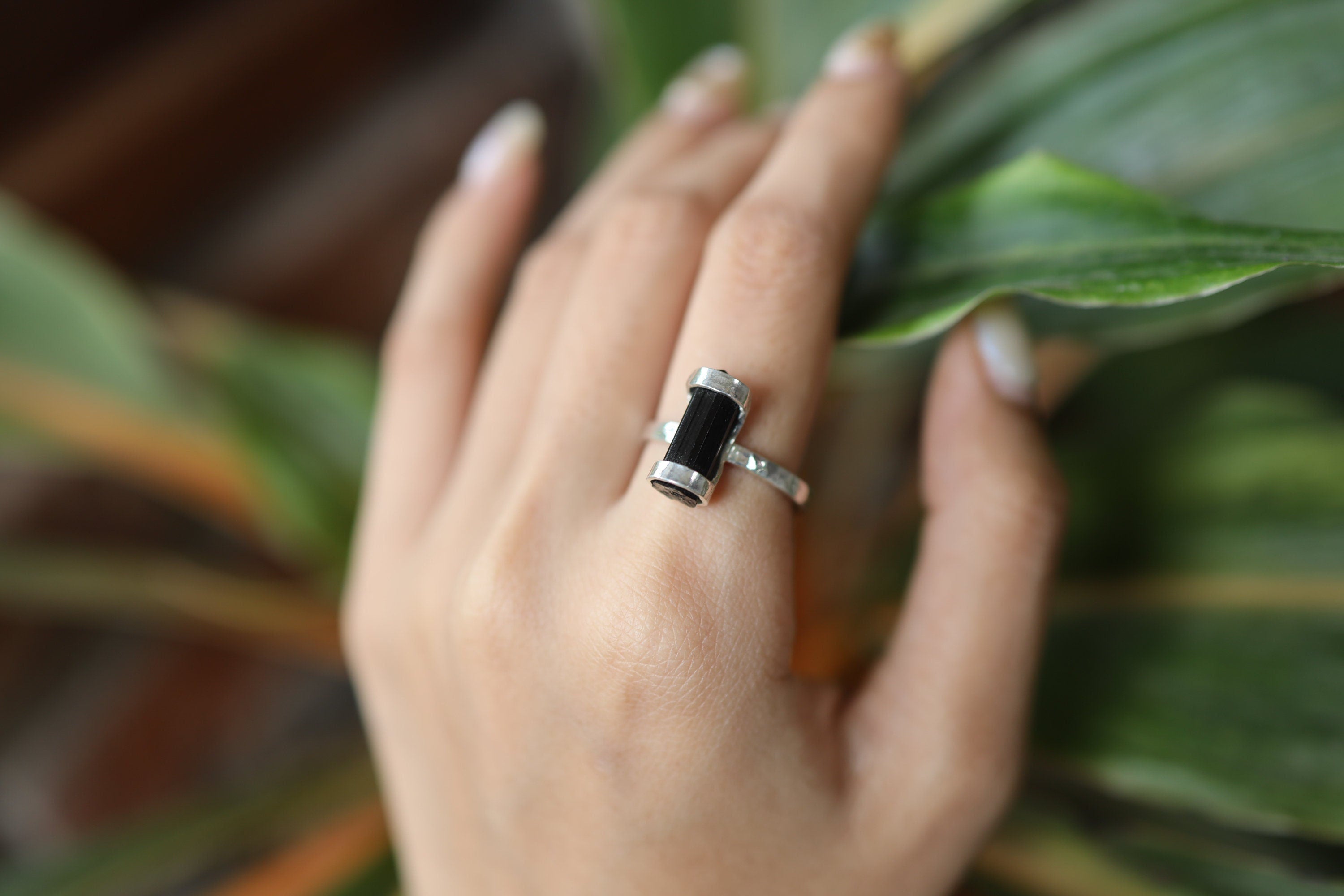 Terminated Black Tourmaline Ring shown worn on hand with oxidized sterling silver and raw black crystal point.