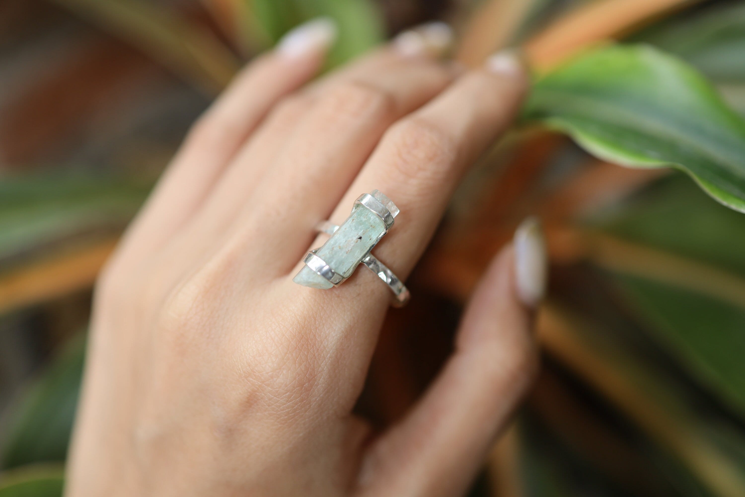 Handmade oxidized 925 sterling silver Australian Aquamarine ring shown worn on the hand, with a soft blue beryl gemstone.