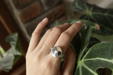 Opal Box Ring shown worn on hand with polished sterling silver secret compartment and hidden gemstone design.