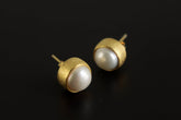 Large South Sea Pearl stud earrings in 16k gold-plated sterling silver shown on a dark background.