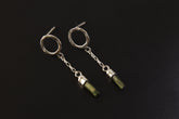 Handmade 925 sterling silver Green Tourmaline chain earrings shown on a dark background, with hammered round studs and raw crystal drops.