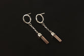 Handmade 925 sterling silver Pink Tourmaline chain earrings shown on the ear, with hammered round studs and raw crystal dangles.