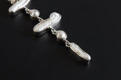 Dangling Moonstone Pearl Pendant: Hammered Sterling Silver Cascade