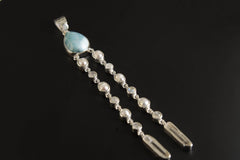 Lightning Ridge Opal Larimar Pearl Moonstone Quartz pendant shown on a dark background with high-shine sterling silver and long crystal dangle.
