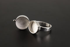 Opal Box Ring shown from the front with opening sterling silver compartment