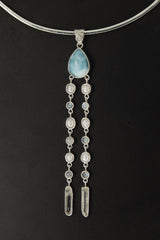 Lightning Ridge Opal Larimar Pearl Moonstone Quartz pendant shown worn on the chest with luminous sterling silver setting.