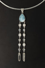 Lightning Ridge Opal Larimar Pearl Moonstone Quartz pendant shown worn on the chest with luminous sterling silver setting.