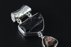 Close-up of raw Mount Darwin Tektite, Watermelon Tourmaline, and Cubic Pyrite in three separate sterling silver bezel settings.