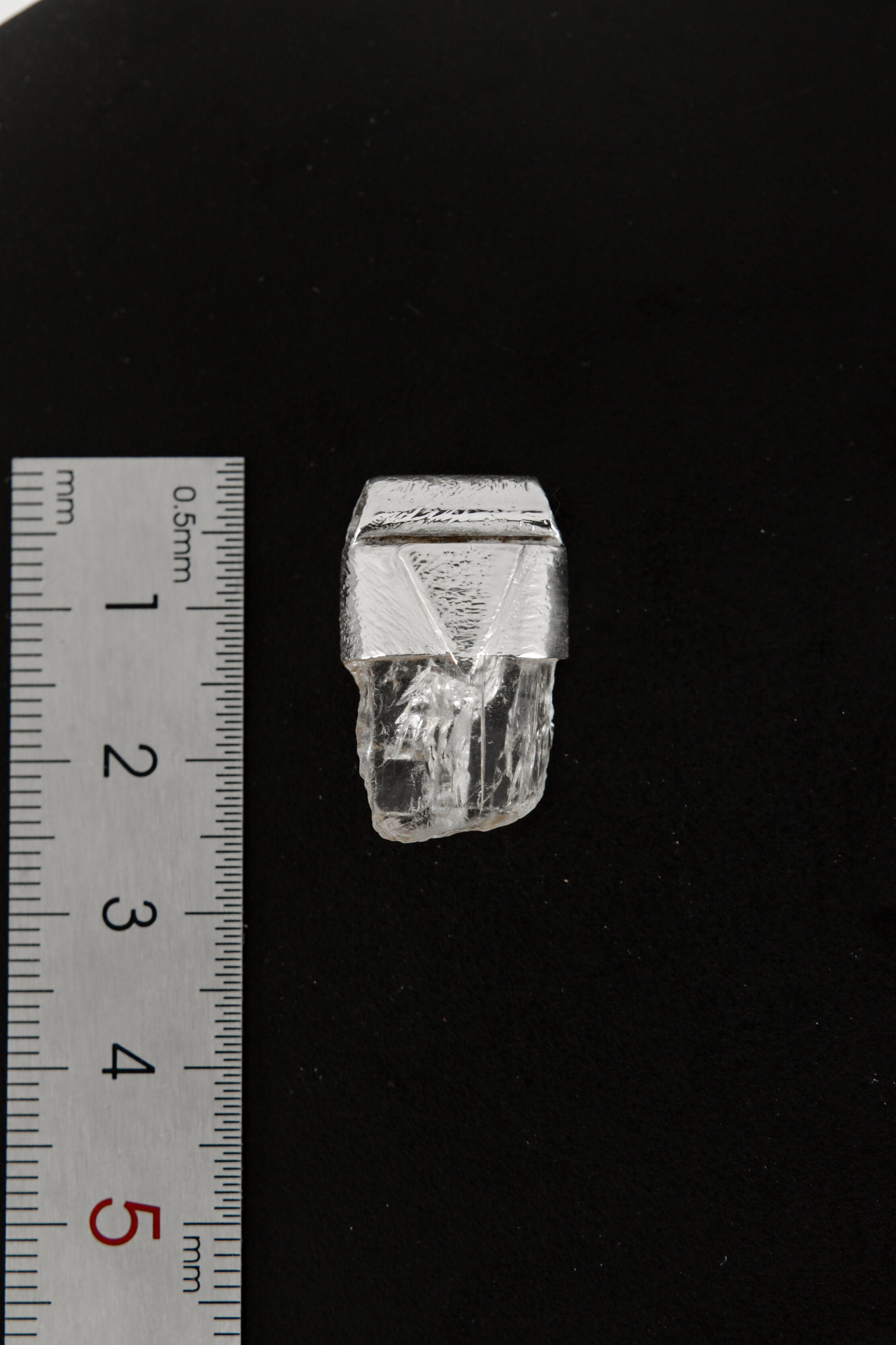 Clear Rainbow Inclusion Spodumene Stack Pendant shown beside a ruler for scale, measuring approximately 2.5 cm long.