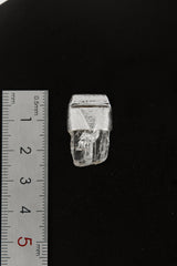 Clear Rainbow Inclusion Spodumene Stack Pendant shown beside a ruler for scale, measuring approximately 2.5 cm long.
