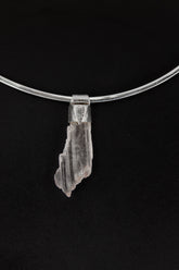 Specimen Crystal Stack Pendant shown on black background with sterling silver cap and natural crystal body.