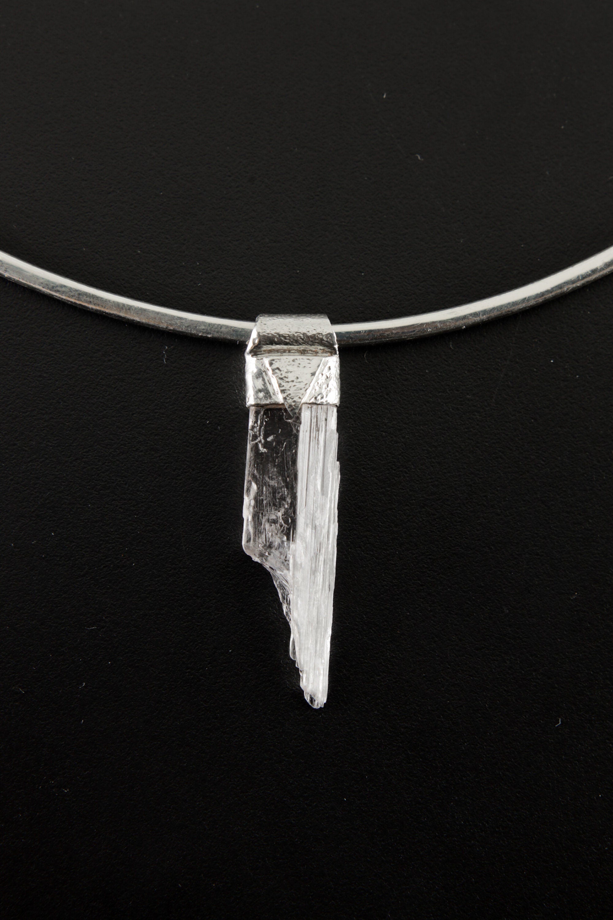 Pink Kunzite Stack Pendant shown on black background with textured sterling silver cap and adjustable necklace.