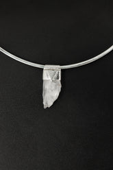 Unpolished Light Pink Kunzite Stack Pendant shown on black background with sterling silver cap and raw lilac crystal.