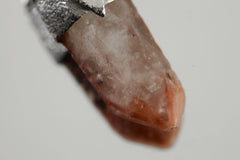 Close-up of Australian Phantom Lithium Quartz with soft lithium-bearing inclusions and handmade sterling silver cap.