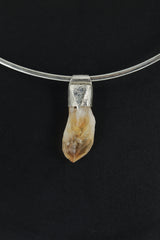 Natural Phantom Citrine Quartz Stack Pendant shown on black background with silver choker and golden crystal point.