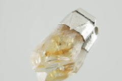Natural Phantom Citrine Quartz Stack Pendant shown on light background with sterling silver cap and golden crystal point.