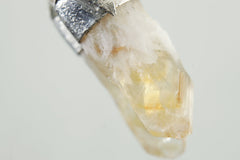 Close-up of Phantom Citrine Quartz showing internal growth layers, golden tone, and natural crystal point.
