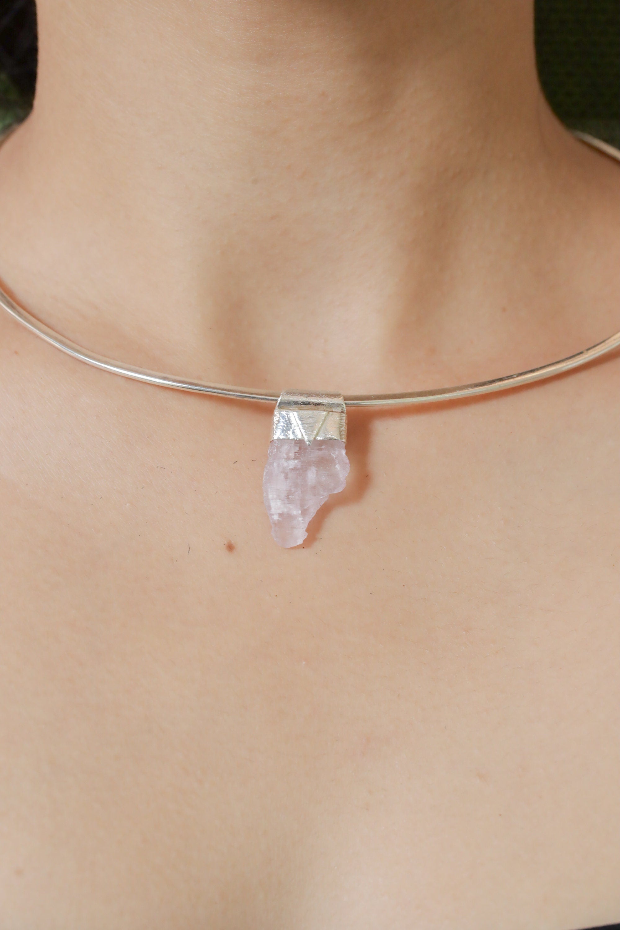 Light Pink Kunzite Stack Pendant shown worn on the chest with sterling silver cap and petite pink crystal.
