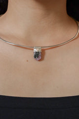 Ruby Black Mica Stack Pendant shown worn on the chest as a small sterling silver layering necklace.