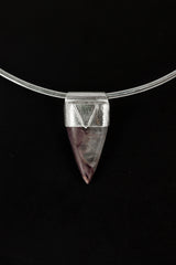 Fang Shaped Charoite Stack Pendant shown on black background with silver choker and purple cabochon body.