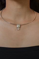 Clear Rainbow Inclusion Spodumene Stack Pendant shown worn on the chest with sterling silver cap and compact crystal body.