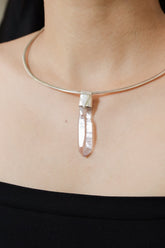 Anhydro Lemurian Vera Cruz Amethyst Stack Pendant shown worn on the chest with sterling silver cap and pale violet crystal.