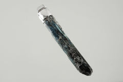 Australian Ocean Kyanite Stack Pendant shown on black background with adjustable black cotton necklace and textured silver cap.