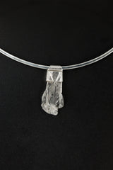 Polished Clear Himalayan Spodumene Stack Pendant shown on a black background with textured sterling silver cap.