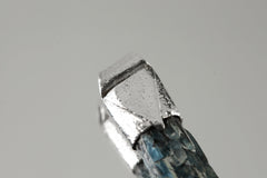 Close-up of Australian Ocean Kyanite in a handmade sterling silver Stack Pendant cap with signature triangle detail.