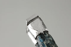 Close-up of Australian Ocean Kyanite in a handmade sterling silver Stack Pendant cap with signature triangle detail.