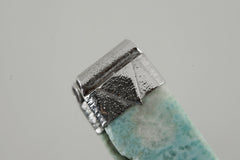 Close-up of Freeform Larimar in a handmade sterling silver Stack Pendant cap with signature triangle detail.