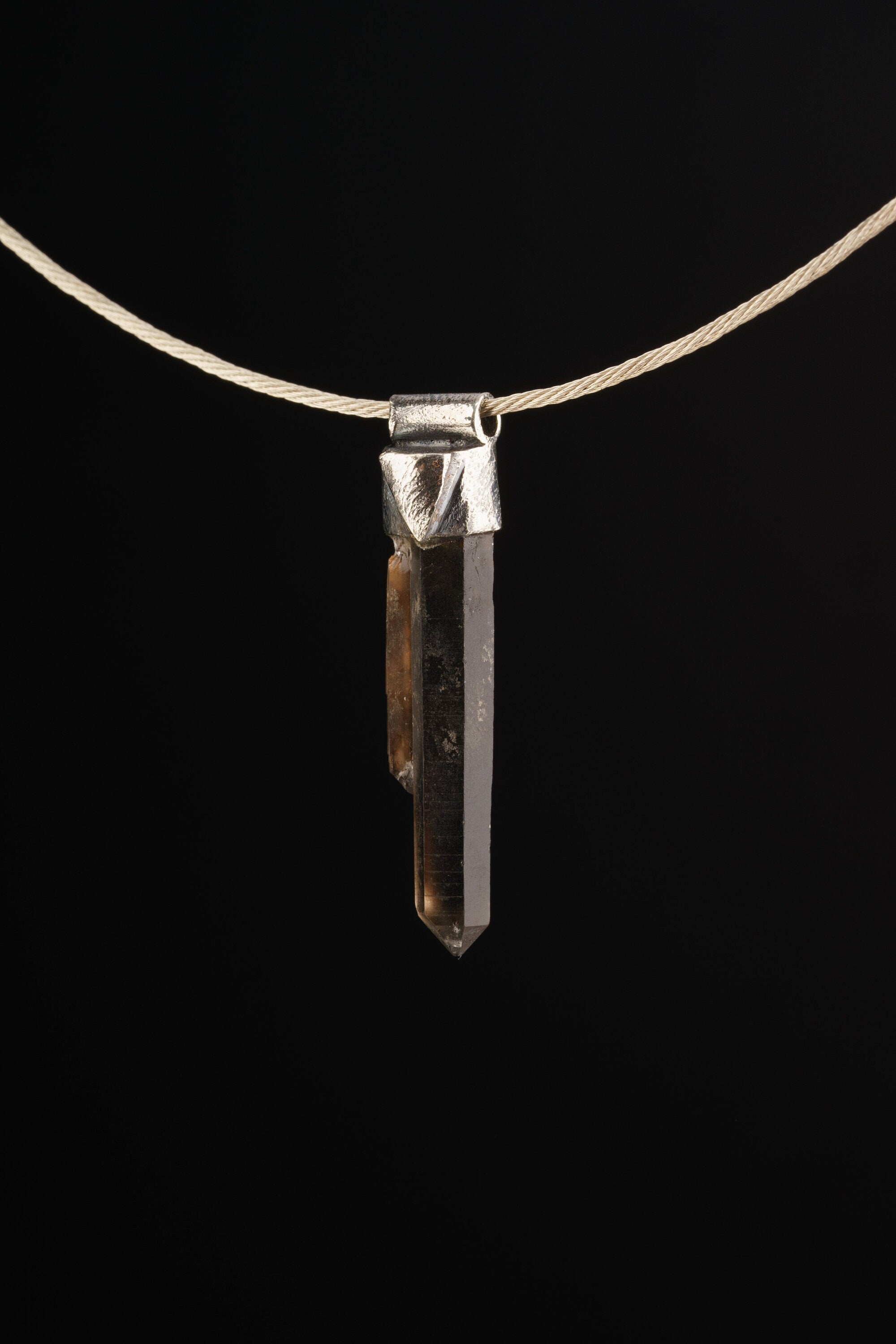 Australian Twin Smoky Citrine Phantom Stack Pendant shown on black background with silver choker and slim crystal body.