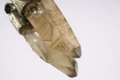 Close-up of Australian Lithium Quartz crystal showing natural clarity, internal detail, and organic sterling silver cap.